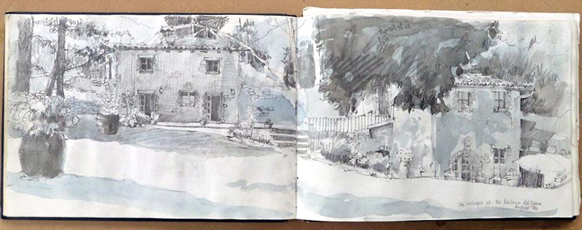 A mono pencil sketchbook spread drawing, with splashes of grey watercolour, of rustic cottages in Fegana Valley.