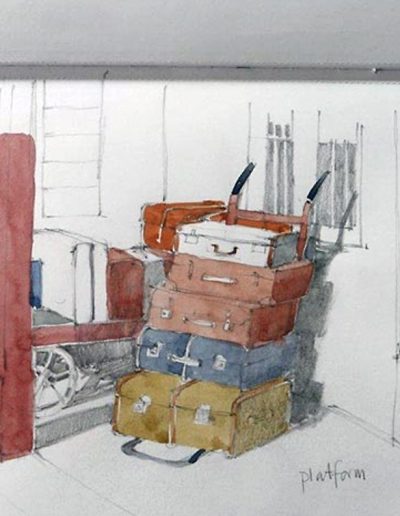 A pencil sketchbook drawing and watercolour, of suitcases stacked up and a trolly of suitcases behind.