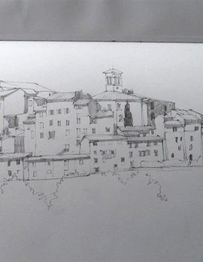 A pencil sketchbook drawing, showing village buildings from afar in Umbria.